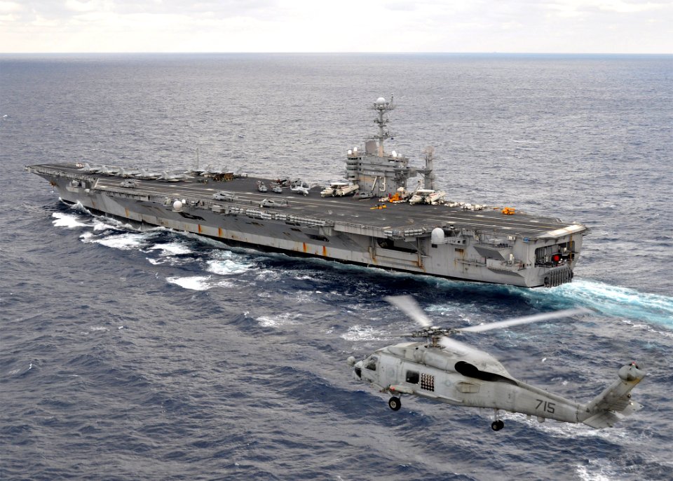 US Navy 091118-N-2013O-250 An SH-60B Sea Hawk helicopter conducts flight operations alongside USS George Washington (CVN 73)