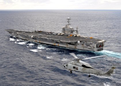 US Navy 091118-N-2013O-250 An SH-60B Sea Hawk helicopter conducts flight operations alongside USS George Washington (CVN 73)