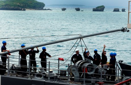 US Navy 091116-N-7280V-053 Sailors aboard the mine countermeasures ship USS Defender (MCM 2) perform scheduled preventive maintenance on the light bulbs on the jack staff while in port