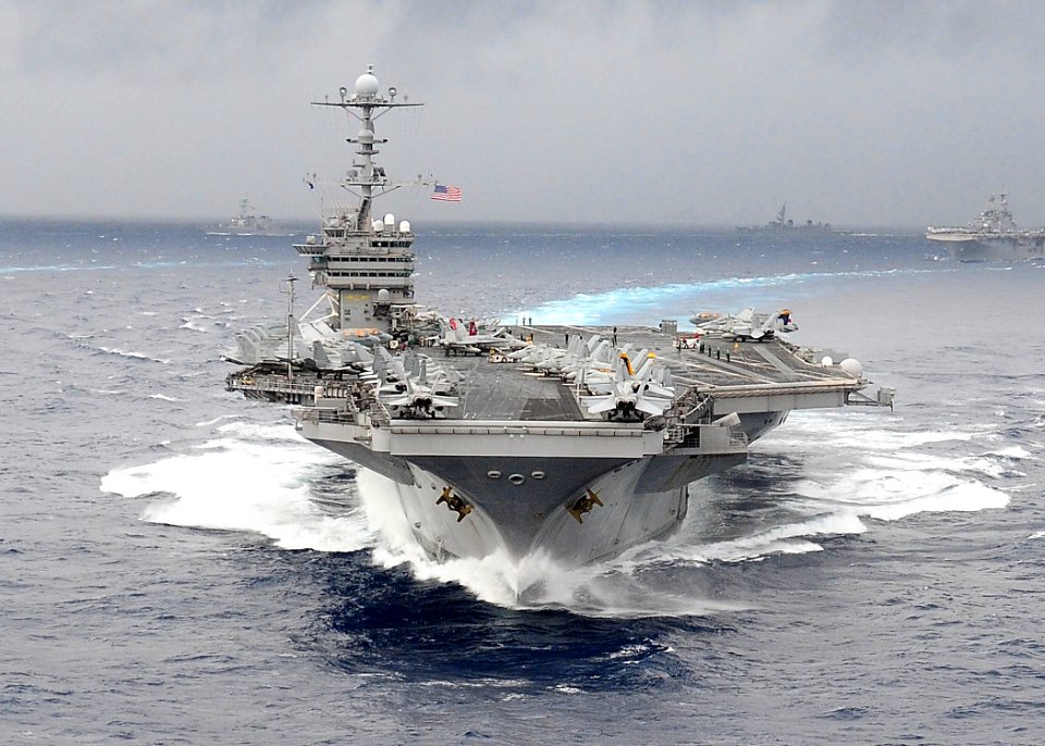 US Navy 091117-N-1644H-897 The aircraft carrier USS George Washington (CVN 73) breaks away from a formation of 26 ships