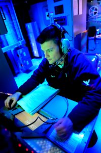 US Navy 091118-N-9928E-020 Sonar Technician 2nd Class Richard Schnitz, from Filmore, Calif., stands watch in the sonar control room aboard the Arleigh Burke-class guided-missile destroyer USS Kidd (DDG 100)