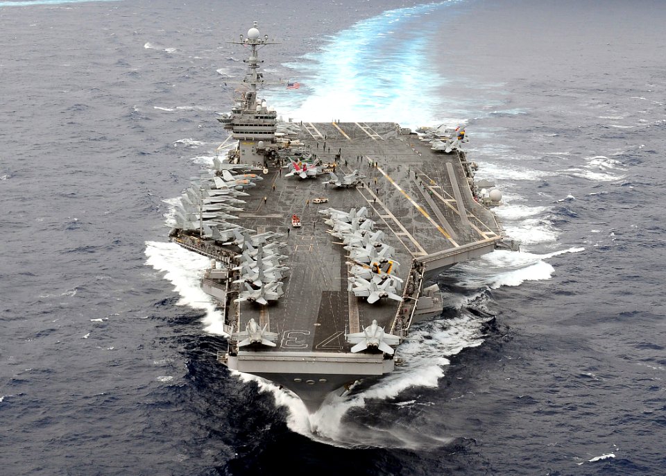US Navy 091117-N-1644H-907 The aircraft carrier USS George Washington (CVN 73) breaks away from a formation of 26 ships