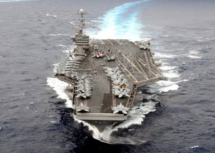 US Navy 091117-N-1644H-907 The aircraft carrier USS George Washington (CVN 73) breaks away from a formation of 26 ships