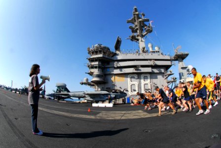 US Navy 091121-N-1786N-008 Sailors compete in a 5-kilometer race on the flight deck of the aircraft carrier USS Nimitz (CVN 68). The Nimitz Carrier Strike Group is on a routine deployment to the U.S. 5th Fleet area of responsib