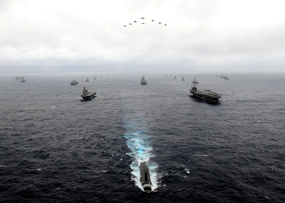 US Navy 091117-N-1644H-767 U.S. Navy and Japan Maritime Self-Defense Force ships transit in formation behind the aircraft carrier USS George Washington