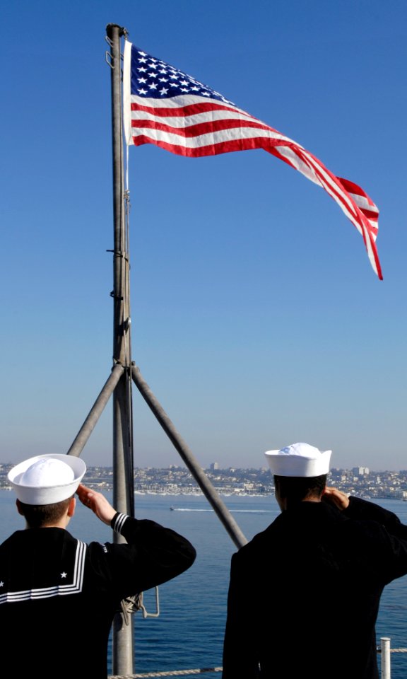 US Navy 091119-N-4954I-047 Sailors salute the national ensign