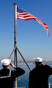 US Navy 091119-N-4954I-047 Sailors salute the national ensign