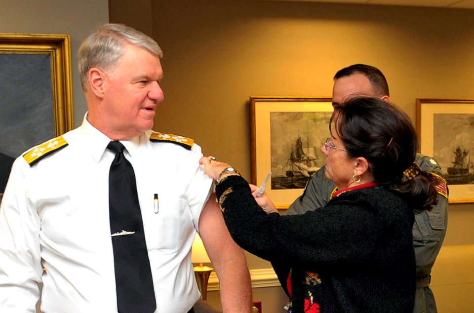 US Navy 091118-N-3548M-006 Suzanne Bucci, an American Red Cross nurse, gives the H1N1 vaccination to Chief of Naval Operations (CNO) Adm. Gary Roughead