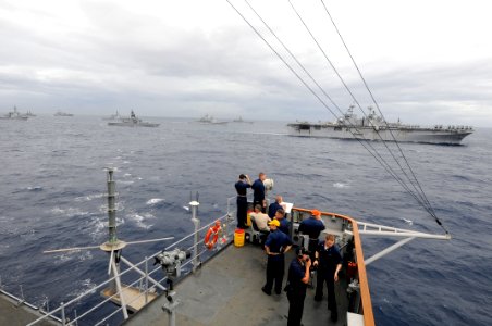 US Navy 091117-N-7280V-368 Watch standers aboard the amphibious command ship USS Blue Ridge (LCC 19) man the port bridge wing as ships from the U.S. Navy and the Japan Maritime Self-Defense Force maneuver into formation