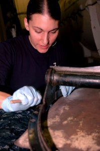 US Navy 091123-N-8960W-008 viation Structural Mechanic 3rd Class Jessica Rice prepares aircraft parts for inspection photo