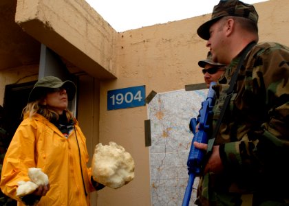 US Navy 091118-N-5087R-071 Chief Petty Officer Matthew D. White, and Lt. jg Jason Holbrook try to calm a disgruntled citizen at the mock riot during a field training exercise