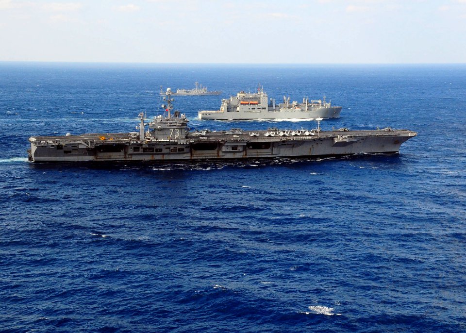 US Navy 091120-N-1644H-412 The USS George Washington (CVN 73) manuvers alongside the USNS Alan Shepard (T-AKE 3) and the USS Crommelin (FFG 37) during a vertical replenishment at sea