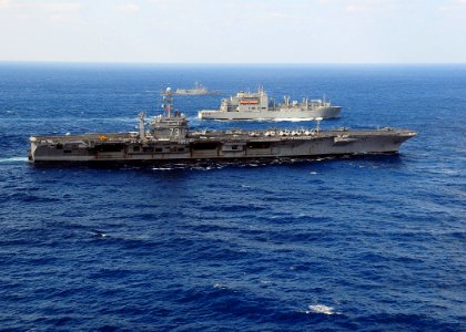 US Navy 091120-N-1644H-412 The USS George Washington (CVN 73) manuvers alongside the USNS Alan Shepard (T-AKE 3) and the USS Crommelin (FFG 37) during a vertical replenishment at sea