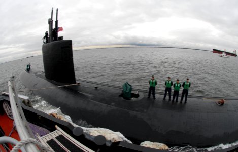 US Navy 091125-N-7705S-020 ailors aboard the Los Angeles-class attack submarine USS Montpelier (SSN 765) prepare deck rigging before receiving lines from a tugboat while en route to Naval Station Norfolk photo