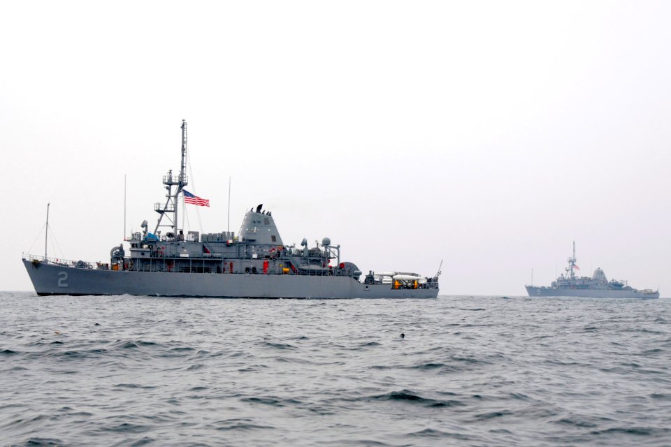 US Navy 091126-N-8335D-114 The mine countermeasures ships USS Defender (MCM 2) and USS Guardian (MCM 5) are underway in the Yellow Sea