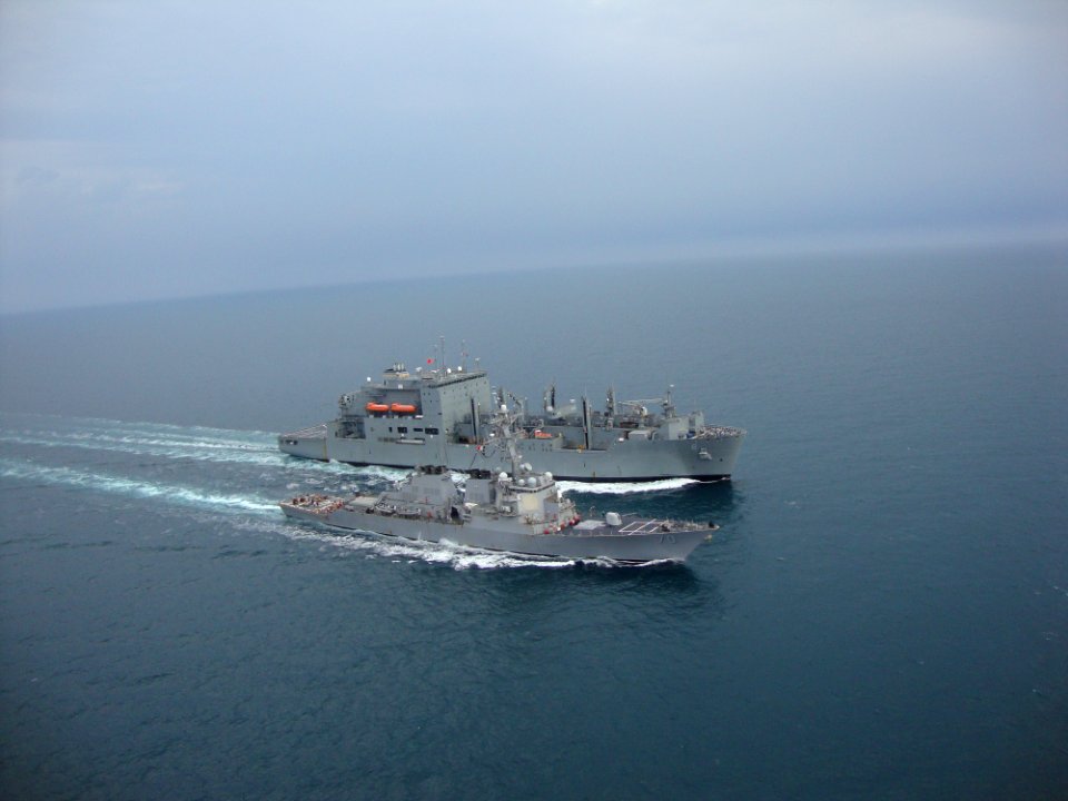 US Navy 091128-N-0000X-057 The Arleigh Burke-class guided-missile destroyer USS Hopper (DDG-70) and the Military Sealift Command dry cargo-ammunition ship USNS Amelia Earhart (T-AKE 2)