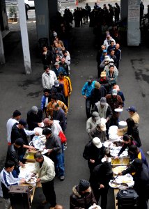 US Navy 091124-N-2638R-002 Sailors assigned to the Yokohama Detachment of Fleet Activities Yokosuka serve food to some of the host-city homeless population