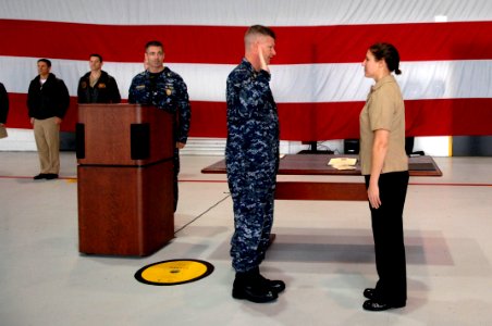US Navy 091202-N-9818V-027 Master Chief Petty Officer of the Navy (MCPON) Rick West administers the reenlistment oath to Aviation Warfare Systems Operator (Mechanical) 1st Class Deborah Spinner during his visit to Air Test and