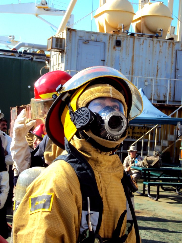 US Navy 091203-N-1241T-043 A Sailor assigned to the guided-missile destroyer USS Hopper (DDG 70) watches his shipmates respond during a fire drill on the Al Basra Oil Terminal (ABOT)