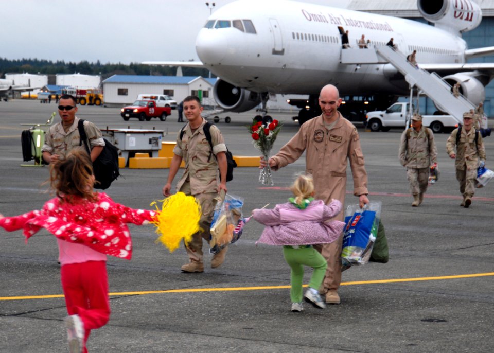US Navy 091124-N-9860Y-001 t. Tom Barlow, from American Fork, Utah, assigned to the Fighting Marlins of Patrol Squadron (VP) 40, is greeted by his daughters during a homecoming for VP-40
