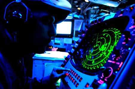 US Navy 091123-N-8335D-024 Mineman Seaman Recruit Chilo Espinoza works at the radar station in the command information center of the mine counter-measures ship USS Defender (MCM 2)