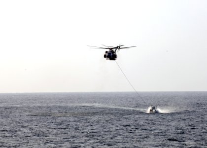 US Navy 091121-N-1291E-086 n MH-53E Sea Dragon helicopter from Helicopter Mine Countermeasures Squadron (HM) 15 drags a MK-105 Mod 4 Sled