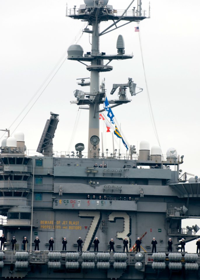 US Navy 091123-N-5253W-004 Sailors man the rails aboard the aircraft carrier USS George Washington (CVN 73) as the ship returns to Commander Fleet Activities Yokosuka