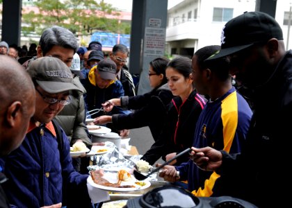 US Navy 091124-N-2638R-001 Sailors assigned to Fleet Activities Yokosuka's Yokohama Detachment serve food to the homeless