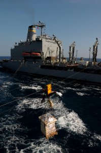 US Navy 091125-N-0260R-037 A pallet of stores is passed between the Military Sealift Command fleet replenishment oiler USNS John Lenthall (T-AO 189) and the guided-missile cruiser USS Chosin (CG 65) during an underway replenish