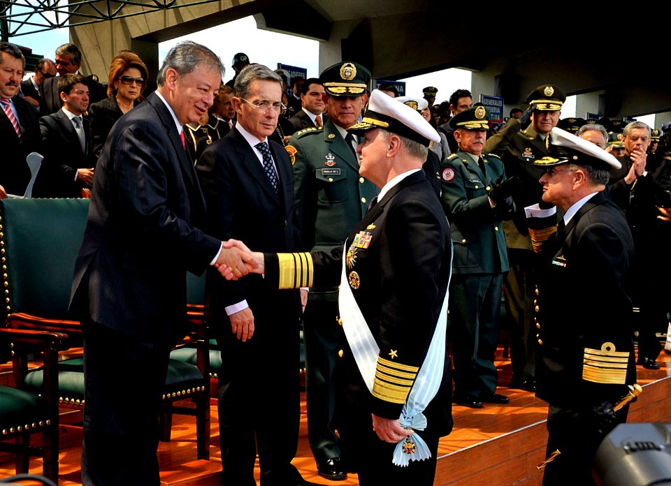 US Navy 091203-N-8273J-152 Chief of Naval Operations (CNO) Adm. Gary Roughead, middle, is congratulated by Minister of Defense Gabriel Silva, left, after receiving the Admiral Padilla Naval Order of Merit from Colombian Preside