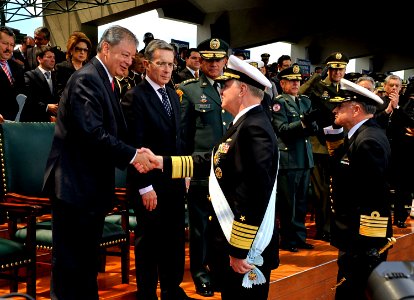 US Navy 091203-N-8273J-152 Chief of Naval Operations (CNO) Adm. Gary Roughead, middle, is congratulated by Minister of Defense Gabriel Silva, left, after receiving the Admiral Padilla Naval Order of Merit from Colombian Preside