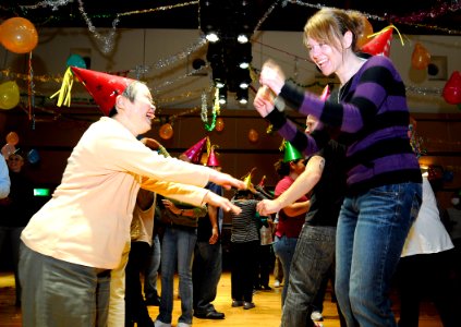 US Navy 091202-N-7280V-287 Personnel Specialist 3rd Class Alycia Hagen dances at the annual Christmas Disco Party for the disabled