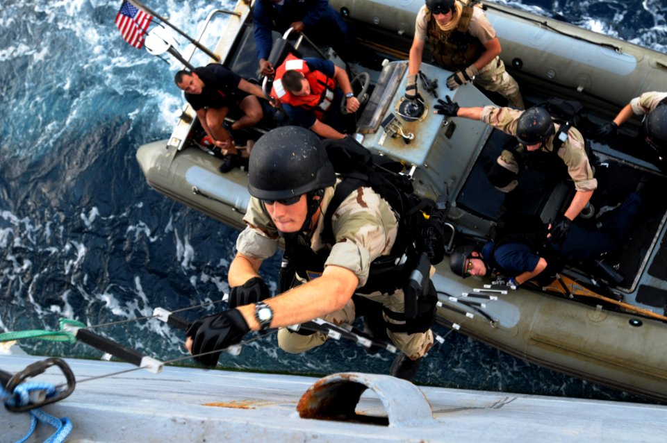 US Navy 091124-N-0260R-035 Members of the visit, board, search and seizure team of the guided-missile cruiser USS Chosin (CG 65) practice boarding techniques from one the ship's rigid hull inflatable boats