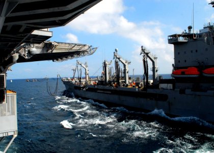 US Navy 091126-N-5148B-046 he amphibious assault ship USS Bonhomme Richard (LHD 6) conducts a replenishment at sea with the Military Sealift Command fleet replenishment oiler USNS John Lenthall (T-AO 189)