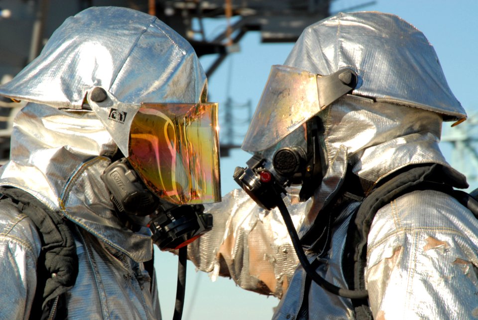 US Navy 091201-N-8913A-060 Aviation Boatswain's Mates (Handling) Airmen Fredrick Stoneham and David Bellgarde participate in a flight deck fire fighting drill