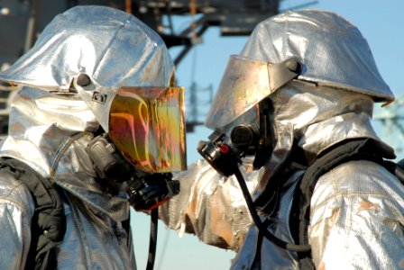 US Navy 091201-N-8913A-060 Aviation Boatswain's Mates (Handling) Airmen Fredrick Stoneham and David Bellgarde participate in a flight deck fire fighting drill