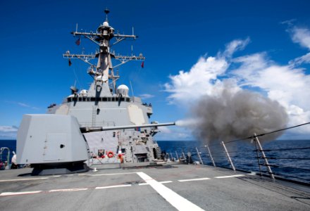 US Navy 091127-N-0000X-001 The guided-missile destroyer USS Pinckney (DDG 95) fires its MK-45 5-inch-54-caliber gun during a pre-aim calibration fire (PACFIRE) training exercise photo