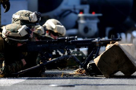 US Navy 091204-N-0890S-086 Marines fire an M-240B machine gun during a combat marksmanship shooting exercise
