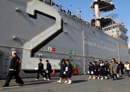 US Navy 091125-N-9950J-116 tudents from Hiu Junior High School tour the amphibious assault ship USS Essex (LHD 2)