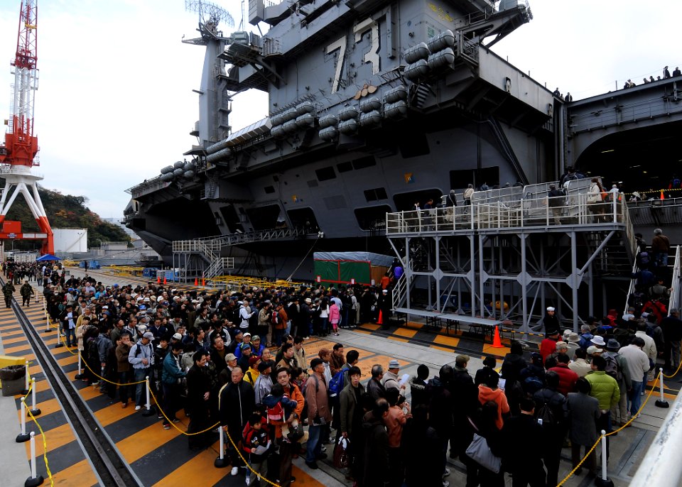 US Navy 091205-N-6233H-039 Japanese citizens wait in line to tour the aircraft carrier USS George Washington (CVN 73) during an open house at Fleet Activities Yokosuka