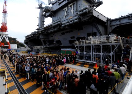 US Navy 091205-N-6233H-039 Japanese citizens wait in line to tour the aircraft carrier USS George Washington (CVN 73) during an open house at Fleet Activities Yokosuka