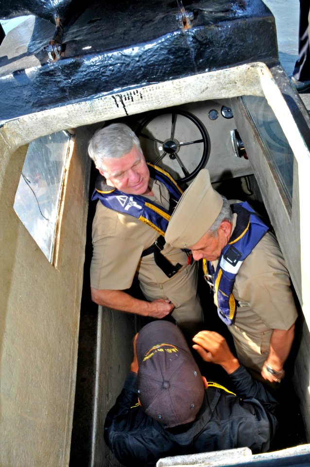 US Navy 091205-N-8273J-180 hief of Naval Operations (CNO) Adm. Gary Roughead rides in a semi-submersible boat while meeting with Colombian Coast Guard Forces at Naval Base Bolivar