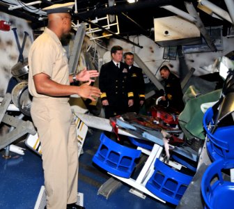US Navy 091204-N-8848T-799 Chief Boatswain's Mate Donald Walker shows a bomb damaged berthing compartment on the Arleigh Burke-class destroyer simulator, USS Trayer (BST 21)