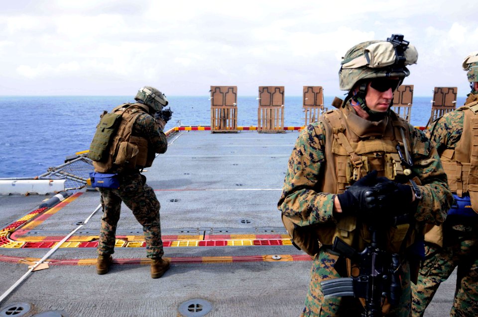 US Navy 091203-N-0890S-073 Lance Cpl. Eric Lyons fires his M-16A4 rifle during a combat marksmanship shooting exercise
