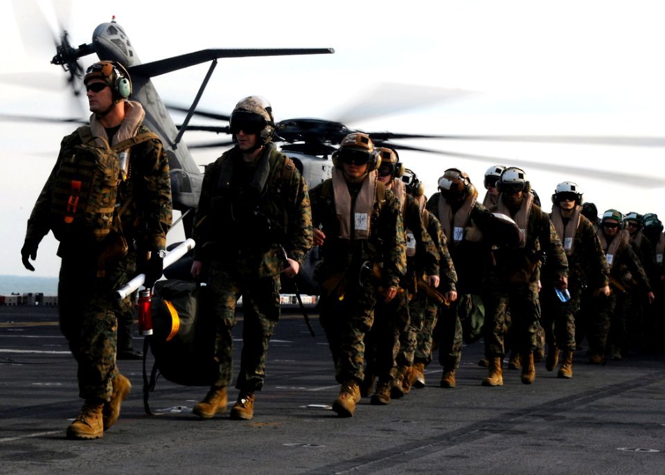 US Navy 091204-N-8655E-494 Marines assigned to the 22nd Marine Expeditionary Unit (22nd MEU) prepare to depart the multi-purpose amphibious assault ship USS Bataan (LHD 5)