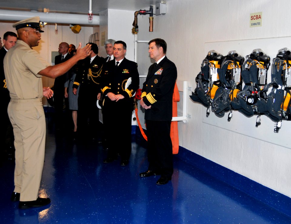 US Navy 091204-N-8848T-790 Chief Boatswain's Mate Donald Walker explains a fire fighting station aboard simulator USS Trayer (BST 21)