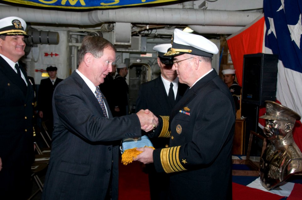 US Navy 091204-N-0757M-001 Adm. J.C. Harvey Jr., commander of U.S. Fleet Forces Command, presents the Medal of Honor flag to retired Capt. Peter Bulkeley