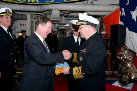 US Navy 091204-N-0757M-001 Adm. J.C. Harvey Jr., commander of U.S. Fleet Forces Command, presents the Medal of Honor flag to retired Capt. Peter Bulkeley