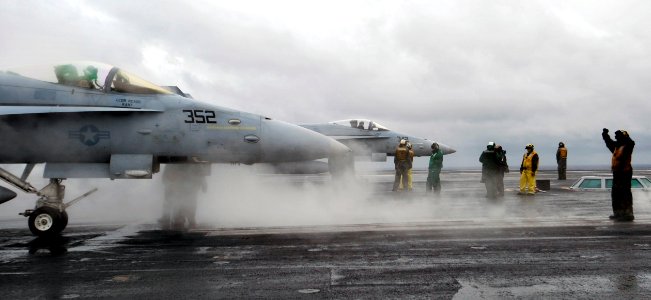 US Navy 091205-N-6003P-481 An F-A-18 from the Romans of Strike Fighter Squadron (VFA 106) prepares to launch from the aircraft carrier USS Harry S. Truman (CVN 75)