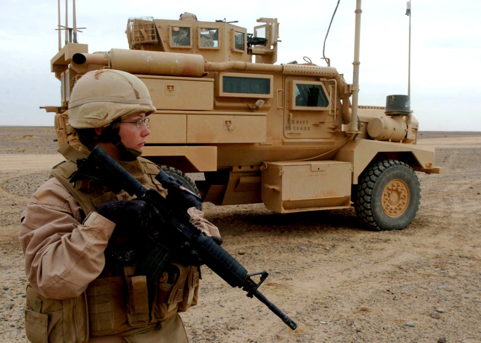 US Navy 091208-N-4440L-097 Construction Electrician 2nd Class Alicia Morgan, assigned to the Naval Mobile Construction Battalion (NMCB) 74 convoy security element, provides entry control point security at a road project site
